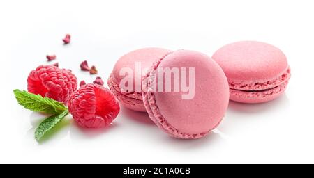 pink raspberry macaroons isolated on white background Stock Photo