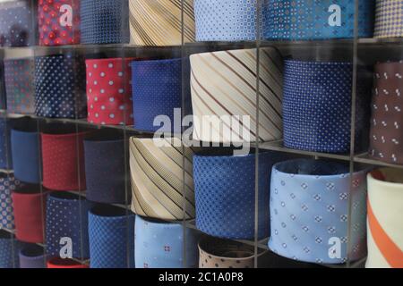 men ties in different colors on display on a clothing stores Stock Photo