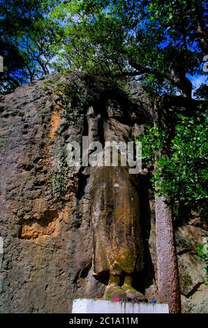 The unfinished Buddha image at Dhowa Raja Maha Vihara rock temple, Bandarawela, Sri Lanka Stock Photo