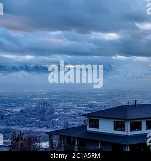 Square Downtown Salt Lake City with snowy mountain and gloomy cloudy sky view in winter Stock Photo