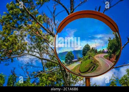 Mirrored road to Lake Maninjao Stock Photo