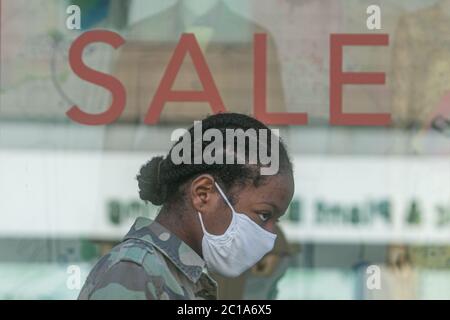 KINGSTON, SURREY, UK. 15 June 2020.  Shoppers queue outside John Lewis department sotre on the day non essential shops reopen as part of the government easing  of lockdown measures to revitalize the struggling economy following a 20.4% drop in gross domestic product (GDP) in April and the UK economy heading for one of the worst recession. Credit: amer ghazzal/Alamy Live News Stock Photo