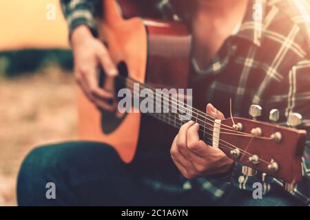 Close up of man hand playing guitar. Stock Photo