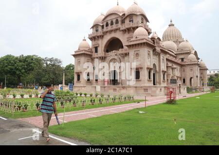 Belur Math, Headquarters of the Ramakrishna Mission finally after more than two months re-open from Monday. However, devotees have to follow several guidelines. Monks of Belur Math use protective gear and maintain social distancing to devotees.The authorities are opening the Math in accordance with the precautionary measures and hygiene rules considering the health of the devotees, visitors, saints and monks, benefactors and the staff of the Math . There will be social distinguishing signs in the Math premises, flowers and Sweets were not allowed in the Math . The place of standing of the de Stock Photo