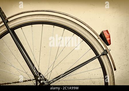 Retro styled image of a bicycle rear wheel with wooden fender Stock Photo