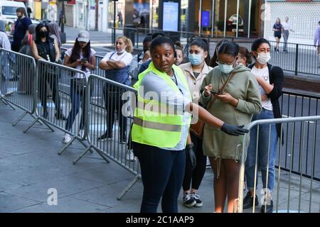 Wood Green Shopping City, North London, UK 15 June 2020 - Shoppers not following social distancing rules as they queue outside Primark in Wood Green, north London as non-essential stores reopen after three months of COVID-19 lockdown. Credit: Dinendra Haria/Alamy Live News Stock Photo