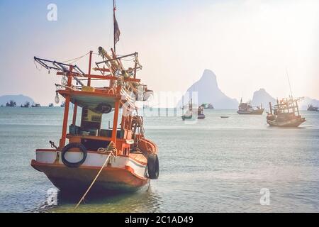 Wooden fishing boat on the coast of Thailand Stock Photo
