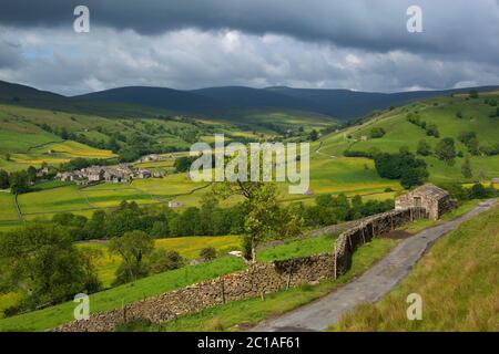 View over the Swaledale valley and village of Muker, Muker, Yorkshire Dales National Park, North Yorkshire, England, United Kingdom, Europe