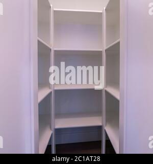 Square frame Empty interior of a walk-in wardrobe interior Stock Photo