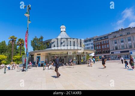 Bournemouth, Dorset UK. 15th June 2020. With the easing of Coronavirus Covid-19 lockdown restrictions, many non-essential shops reopen from today. Visitors stop for something to eat or drink at Obscura Cafe in the Square, as others pass by.  Credit: Carolyn Jenkins/Alamy Live News Stock Photo