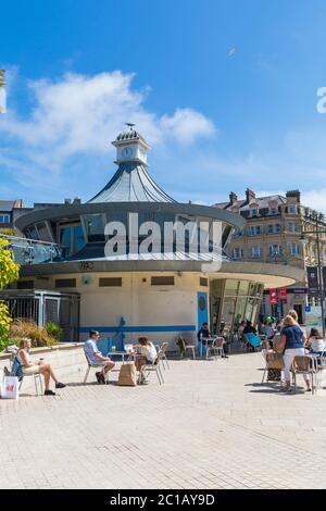 Bournemouth, Dorset UK. 15th June 2020. With the easing of Coronavirus Covid-19 lockdown restrictions, many non-essential shops reopen from today. Visitors stop for something to eat or drink at Obscura Cafe in the Square, as others pass by.  Credit: Carolyn Jenkins/Alamy Live News Stock Photo