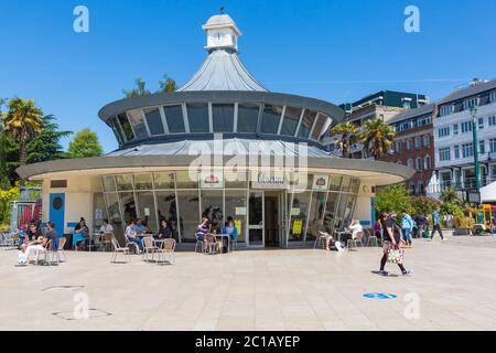 Bournemouth, Dorset UK. 15th June 2020. With the easing of Coronavirus Covid-19 lockdown restrictions, many non-essential shops reopen from today. Visitors stop for something to eat or drink at Obscura Cafe in the Square, as others pass by.  Credit: Carolyn Jenkins/Alamy Live News Stock Photo
