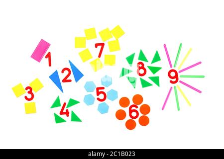 Multicolored plastic figures and numbers on a white background. Educational games for children. Math and calculation skills. Stock Photo