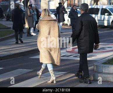 Milan, Italy, 11 January 2020:Couple street style outfits before Armani fashion show during Milano fashion week 2020 Stock Photo