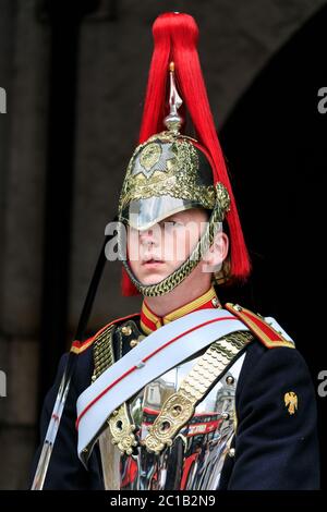 Young soldier, close up portrait, Blues and Royals member of the Household Cavalry in uniform at Horse Guards Parade, London, UK Stock Photo
