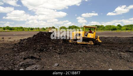 Asphalt mining in the Pitch Lake at La Brea, Trinidad and Tobago Stock Photo