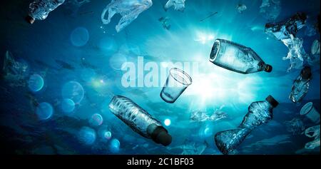 Plastic Pollution In Ocean - Underwater Shine With garbage Floating On Sea - Environmental Problem Stock Photo