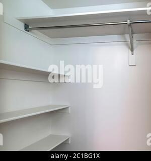 Square frame Empty walk in closet interior with small window carpet ...