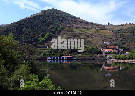 Portugal, Douro Region, Pinhao. Panoramic view of Pinhao and the surrounding hills and vineyards reflected on the Douro River. UNESCO World Heritage. Stock Photo