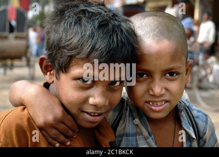 Two young boys in the streets of Dhaka, Bangladesh. The boys are in the area of Sadarghat near the river. Local life, Dhaka, Bangladesh. Stock Photo