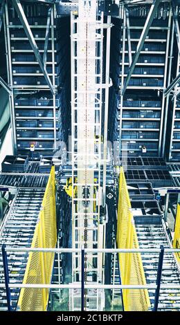 Lift in modern automated warehouse, color toned picture.