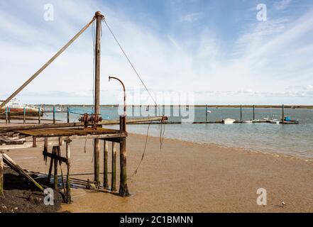 Burnham on Crouch coast line showing the blackwater and  a pier in an industrial setting Stock Photo