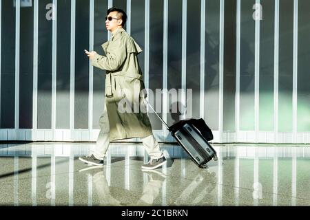 Travellers In The Departure Lounge At Beijing Capital International Airport, Beijing, China Stock Photo