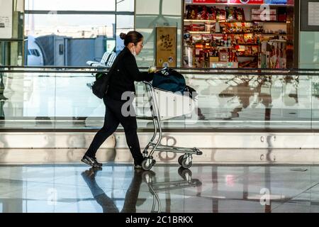 Travellers In The Departure Lounge At Beijing Capital International Airport, Beijing, China Stock Photo