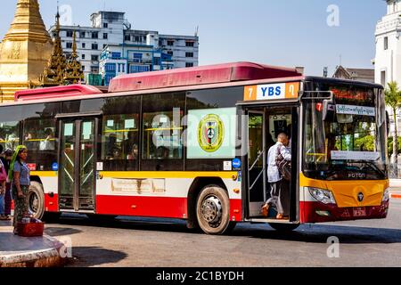 Local People Getting On A Bus, Yangon, Myanmar. Stock Photo