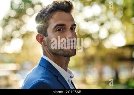 Confident businessman out in the city on a sunny afternoon Stock Photo