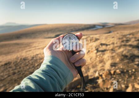 Compass in Hand Natural background .Vintage Tone Stock Photo