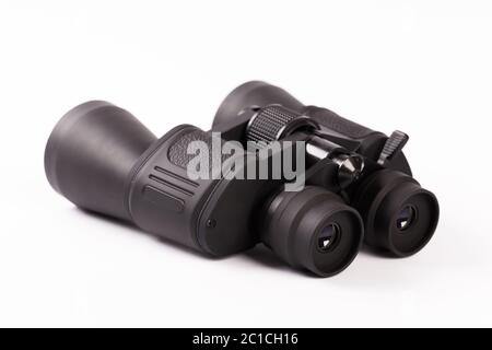 Black binoculars with orange lens isolated on white background Stock Photo