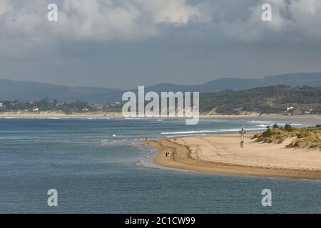 People enjoying a summer day on a beach in Santander, Spain Stock Photo