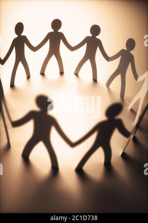 Group of people, united in the meeting of an organization. Paper cut out in the shape of people.
