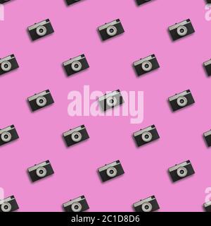 Retro seamless pattern with vintage camera on pink background Stock Photo