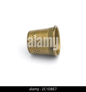 Old copper thimble close-up isolated on white background Stock Photo