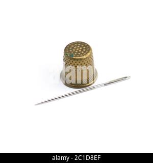 Old copper thimble close-up isolated on white background Stock Photo