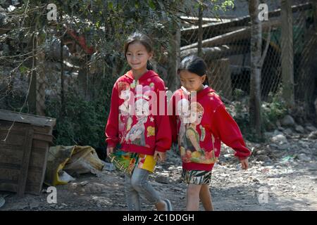 Young, indigenous, ethnic Hmong girls in her village in Luang Namtha Province, northern Laos. Stock Photo