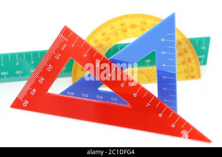School drawing tools. Triangle, ruler, protractor on white background Stock Photo