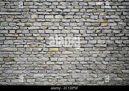 Gray stone wall from an old house Stock Photo