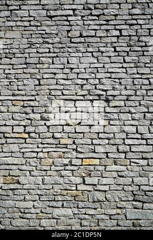 Gray stone wall from an old house Stock Photo