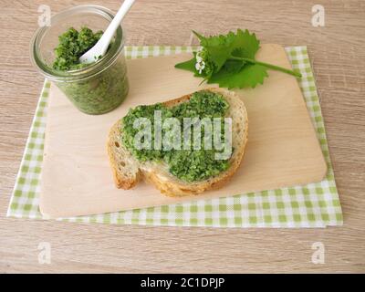 Homemade garlic mustard pesto on baguette Stock Photo