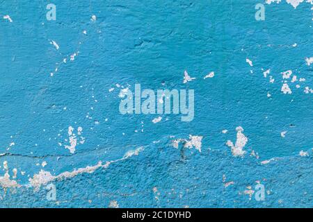 Old concrete blue painted wall with bumps and drips. Abstract background Stock Photo