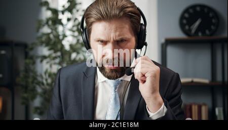 Businessman having distant conversation Stock Photo