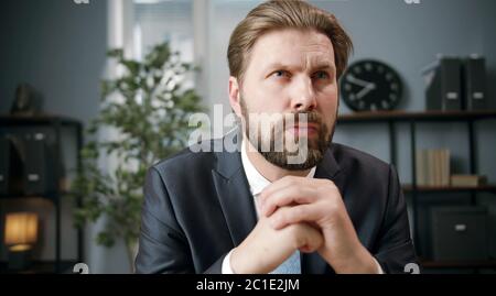 Businessman absorbed with thoughts Stock Photo