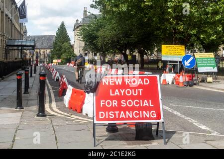 Non essential shops reopen in Bath. Pavements widened in the City with street barriiers in place so social distancing measures can be met. England, UK Stock Photo