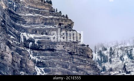 Panorama Bridal Veil Falls in scenic Provo Canyon with thick clouds overhead in winter Stock Photo