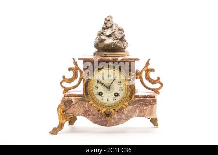 Studio photo of antique mantel clock on white background. Western Europe Stock Photo