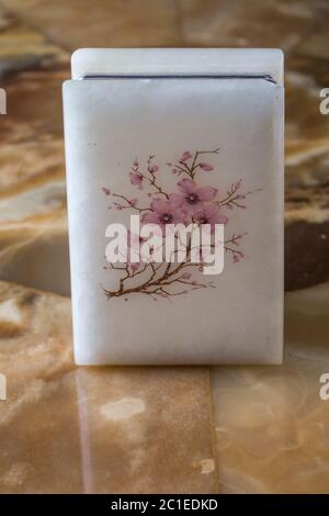 An old beautiful marble box with an engraved flower on the lid in oriental style. Western Europe. End of the 19th century Stock Photo