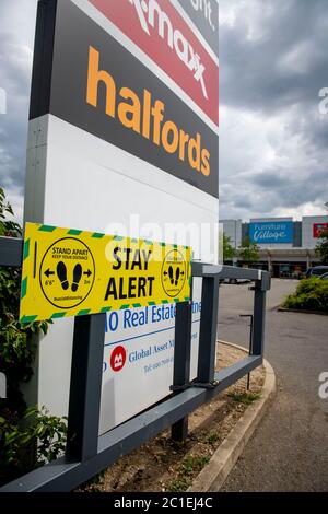 Stay alert signs for social distancing at the entance of the car park to the retail park in Ruislip, London Borough of Hillingdon Stock Photo